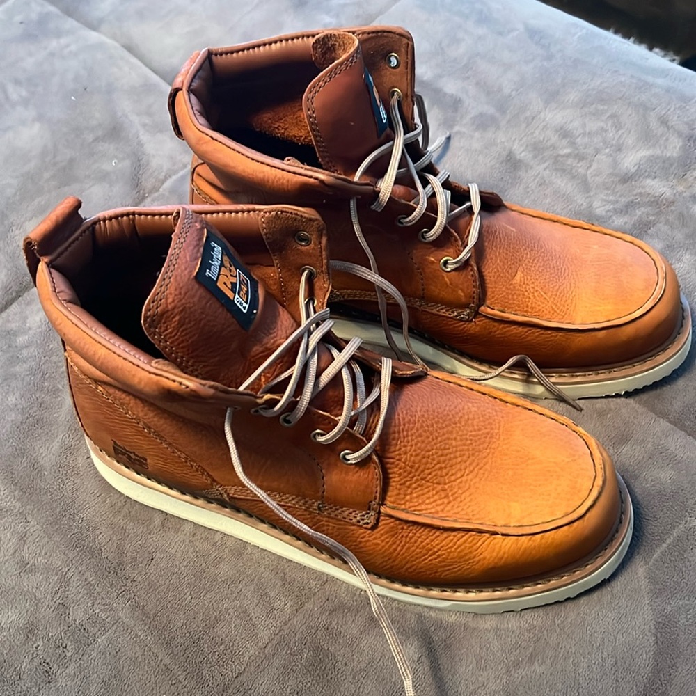Timberland Pro boots size 15W. Beautiful tan color, with hard rubber bottoms.